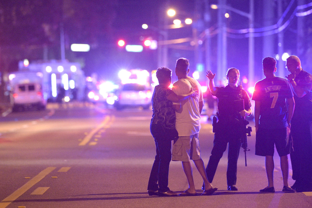 Orlando police officers and bystanders outside of shooting at a nightclub in Orlando, FL, on Sunday. Photo by Phelan M. Ebenhack.