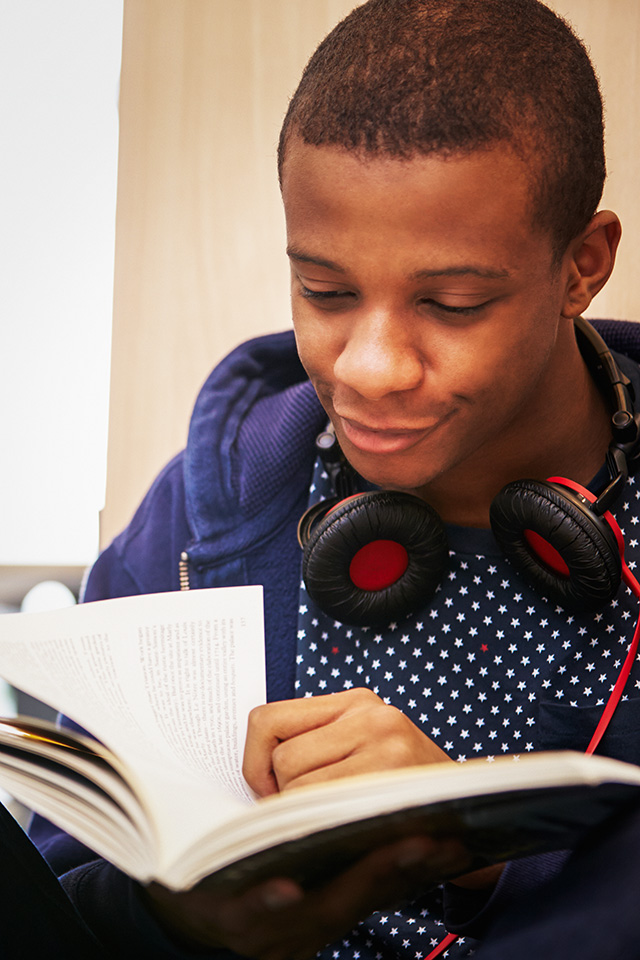 Student Studying In Library